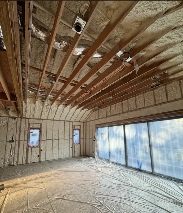 Interior walls and ceiling insulated with spray foam during new construction in Livermore